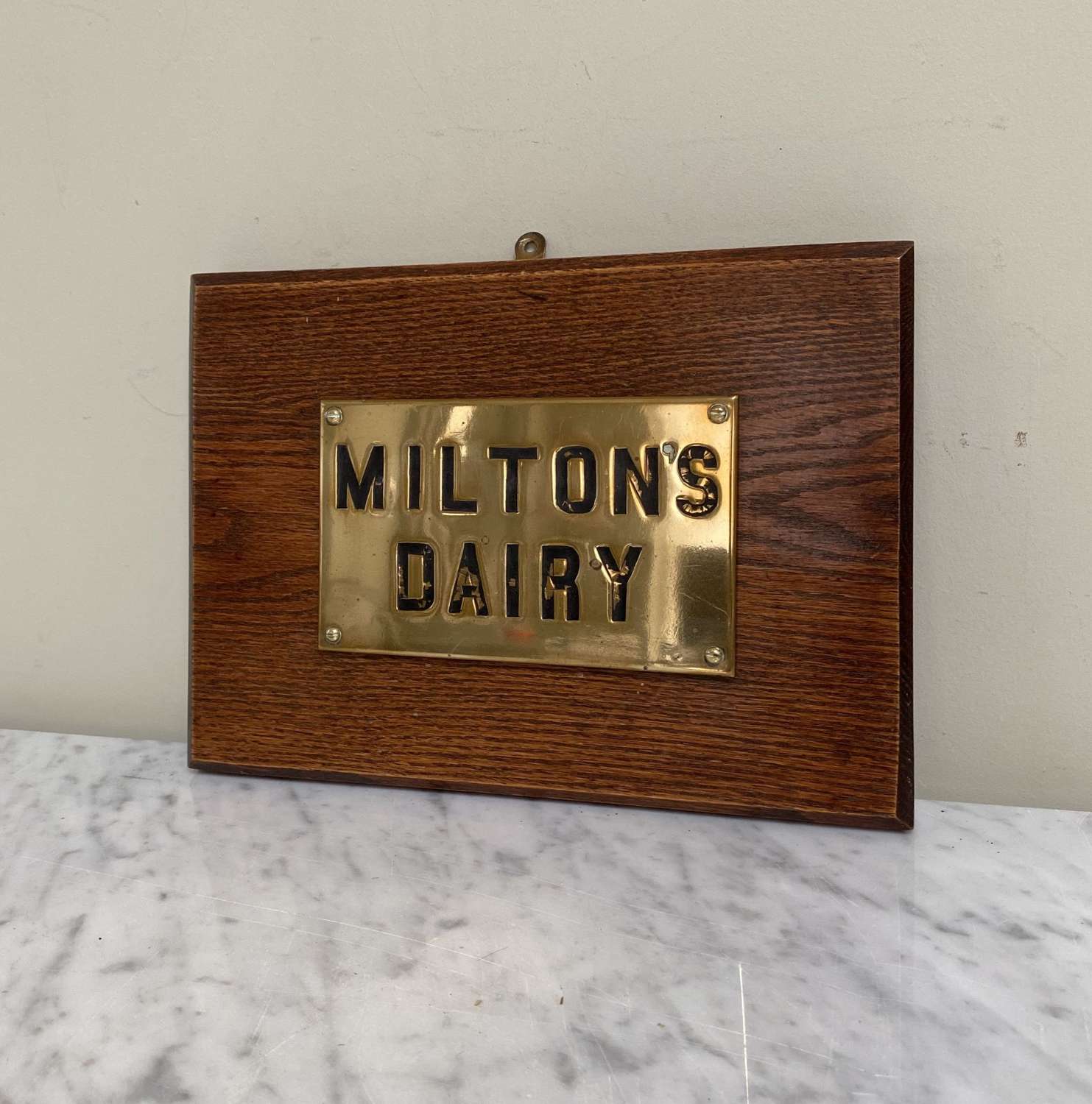 Late Victorian Brass Miltons Dairy Sign Mounted on Oak Board