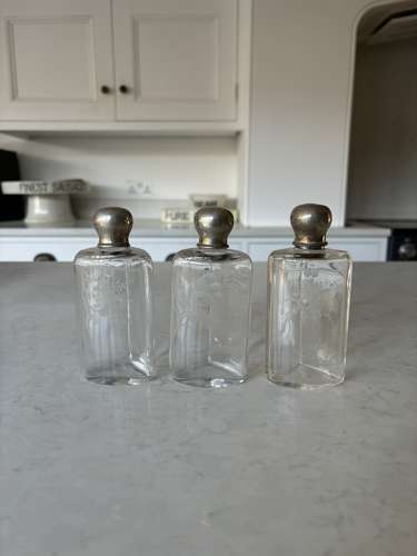 Three Early 20thC Etched Glass Scent Bottles with Real Silver Tops