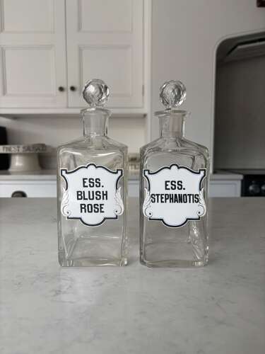 Pair of Edwardian Glass Perfumery Bottles with Painted Enamel Labels. Excellent Condition.
