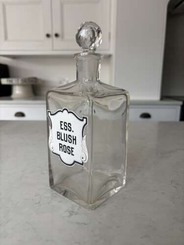 Pair of Edwardian Glass Perfumery Bottles with Painted Enamel Labels. Excellent Condition.