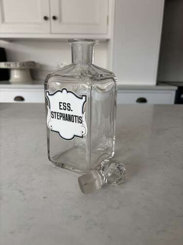 Pair of Edwardian Glass Perfumery Bottles with Painted Enamel Labels. Excellent Condition.